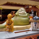 Jabba the Hut, R2D2, and C3PO working on Jabba's sailing barge