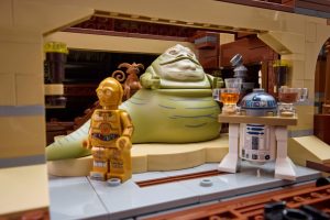 Jabba the Hut, R2D2, and C3PO working on Jabba's sailing barge